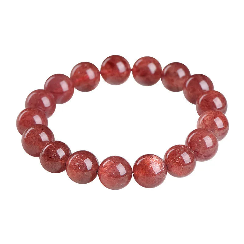 Natural cherry red strawberry quartz bracelet with geometry-shaped beads on a white background.