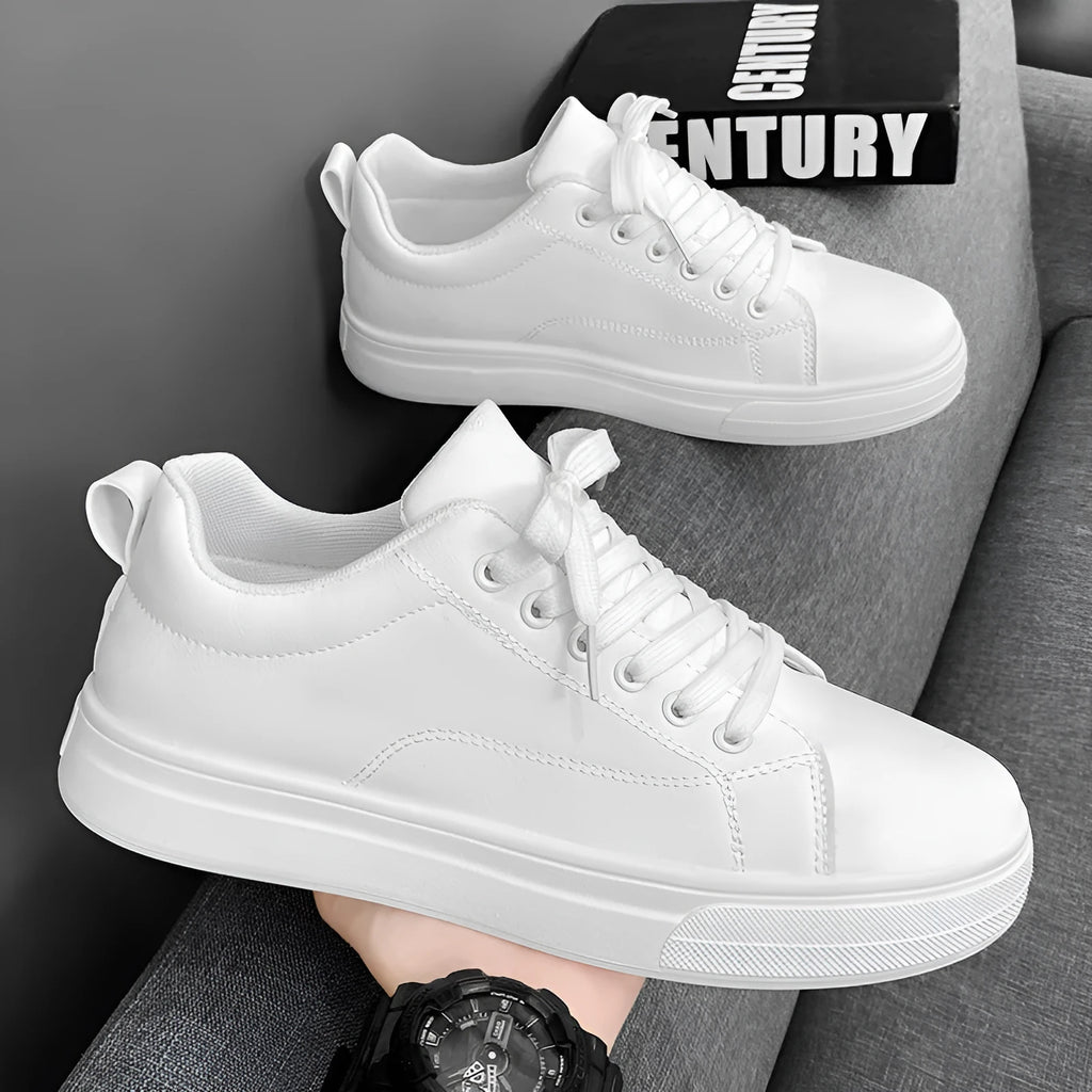 Men's white and black Korean-style low-top casual sneakers with round toe and flat heel.