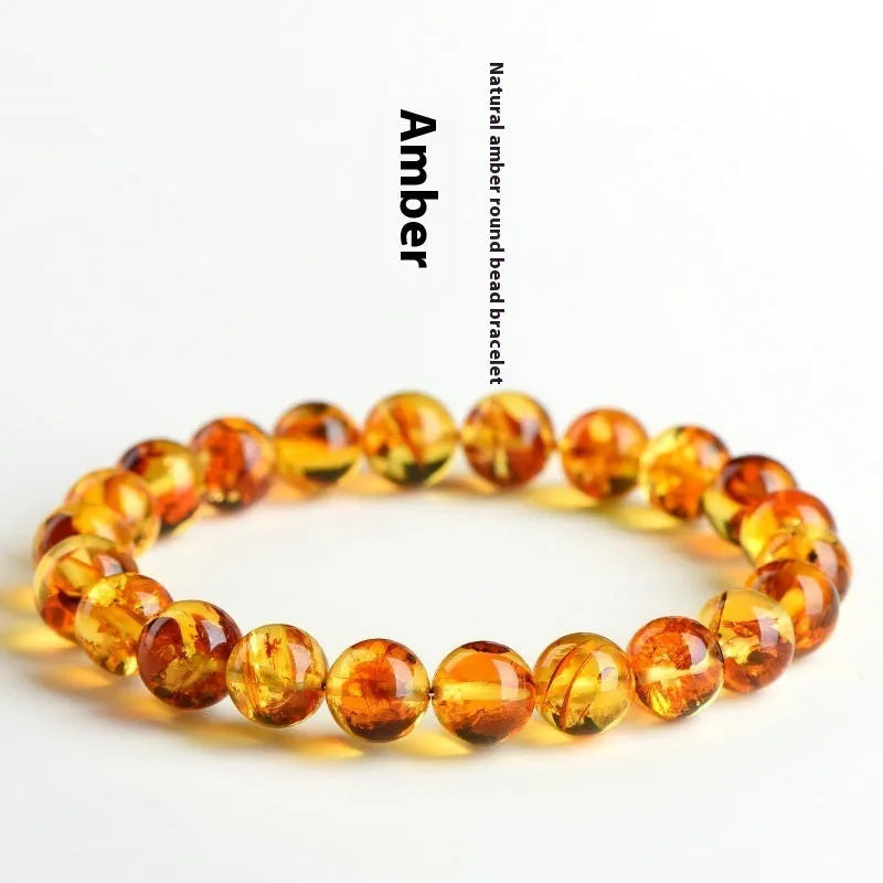 Natural yellow piebald amber bracelet with geometric design and polished Baltic amber beads
