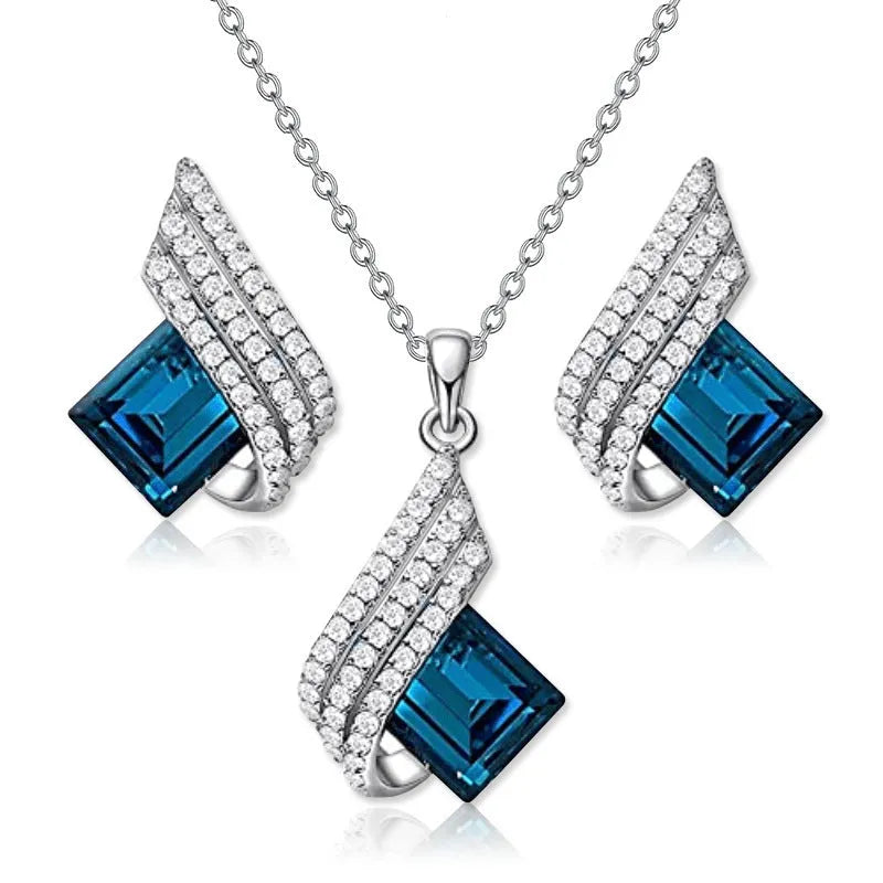 Gold-toned women's necklace and earring set with alloy, glass, and a cross chain, shown in two style options.