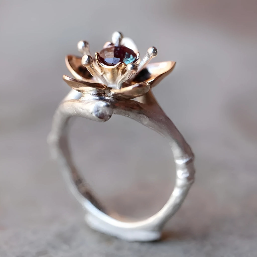 Silver two-tone women's ring with geometric shapes and floral design elements on alloy metal