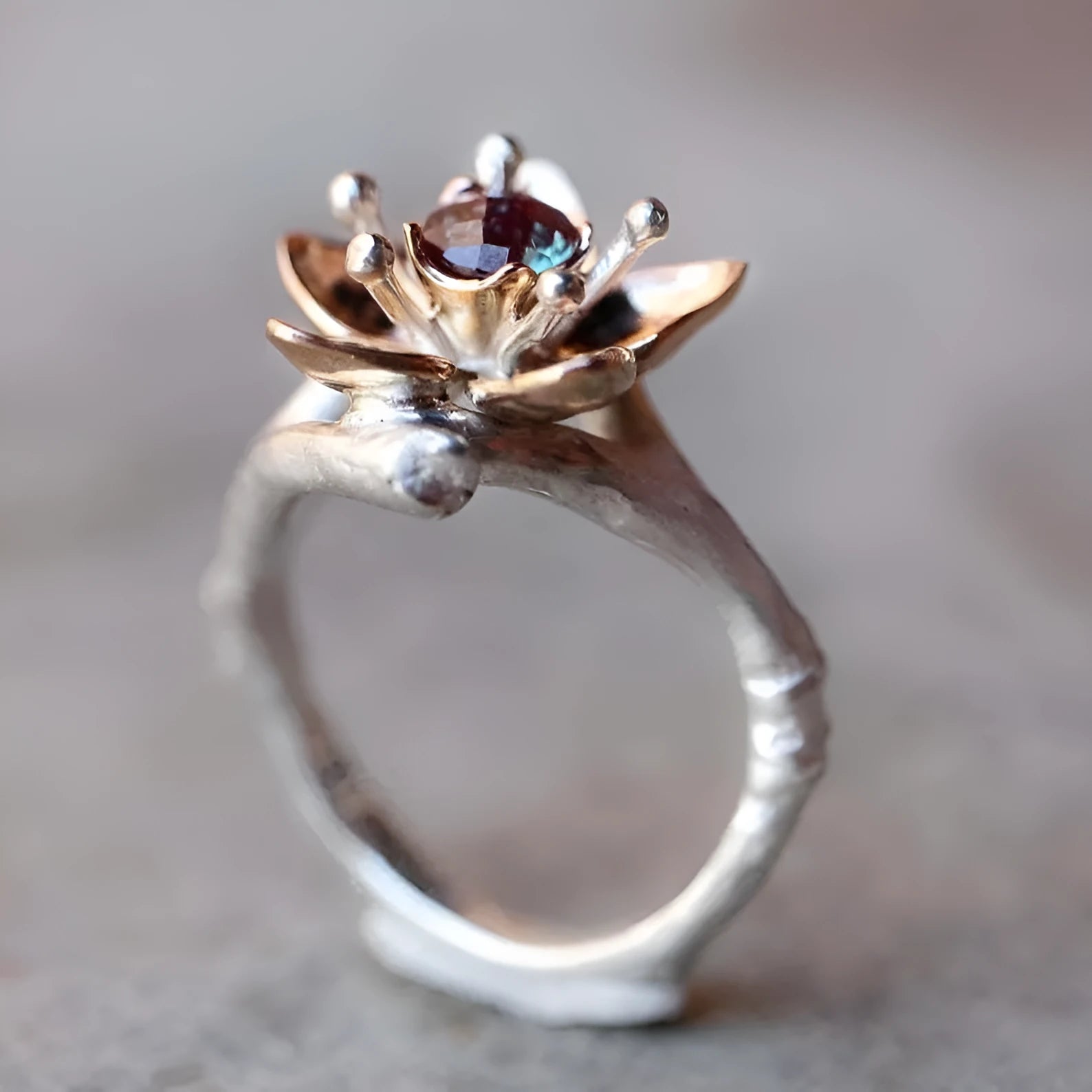 Silver two-tone women's ring with geometric shapes and floral design elements on alloy metal