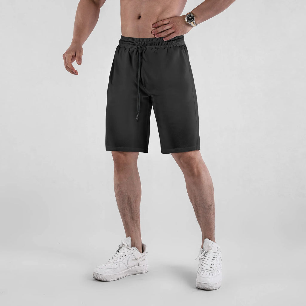 Men's black mesh fitness shorts with quick-drying fabric and mid-waist loose casual design