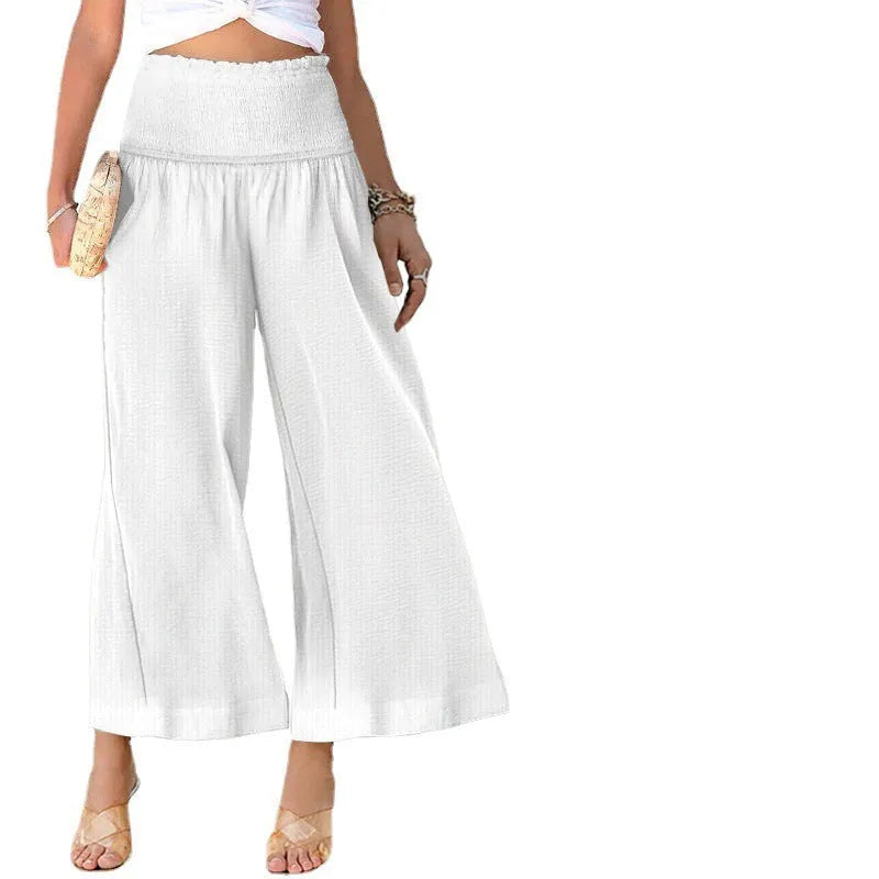 Women's high-waist pleated casual trousers in a cotton blend, shown in a cropped straight-leg style.