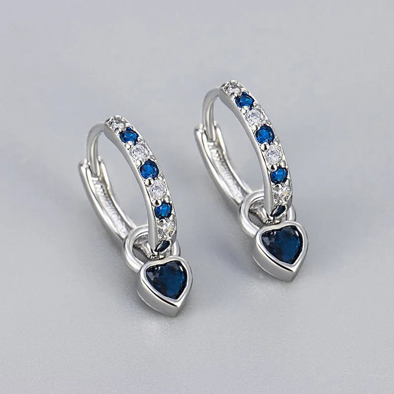 Women's heart-shaped ear clips with a coloured stone, available in gold or white gold colour.