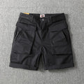 Men's straight-leg cotton cargo shorts in army green with multiple pockets on the legs.