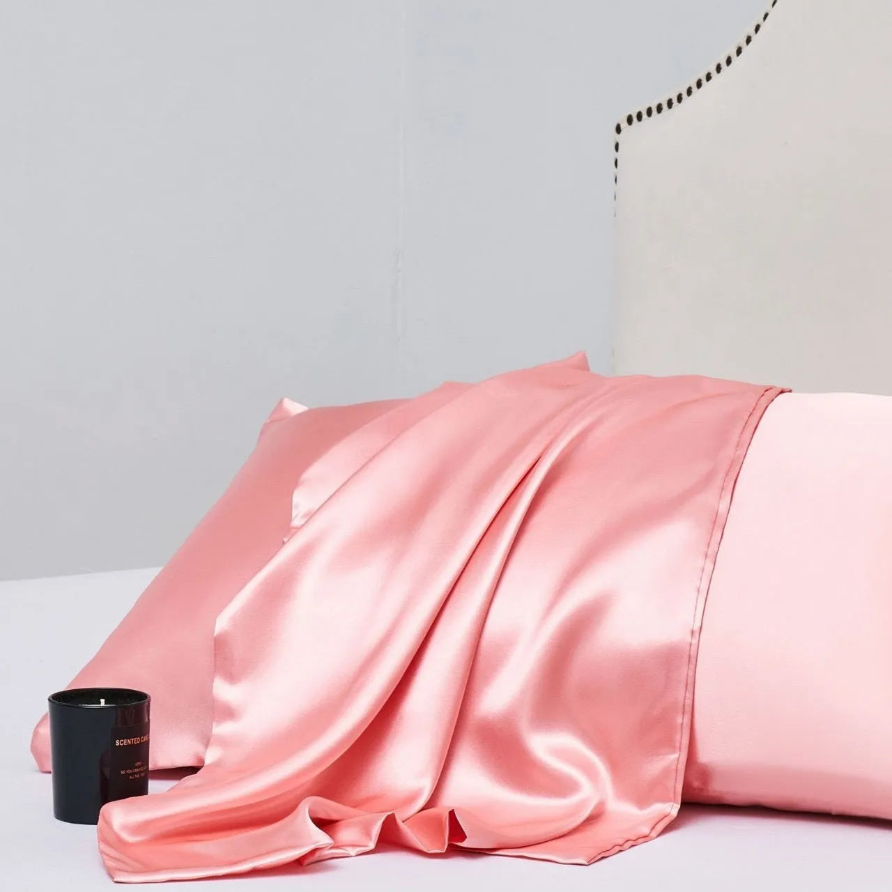 Pair of solid colour satin cloth pillowcases in polyester fibre available in twelve colours and four sizes