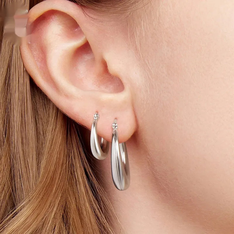 Women's geometric ring ear clip earrings in copper with silver needle detailing