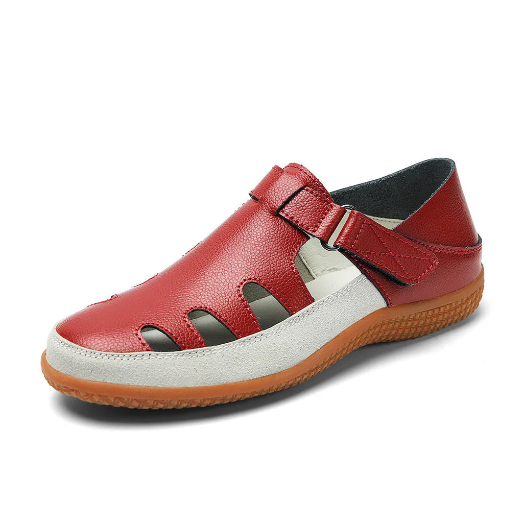 Women's plus size flat sandals in blue with hollow toe cap and breathable design on a thick rubber sole.