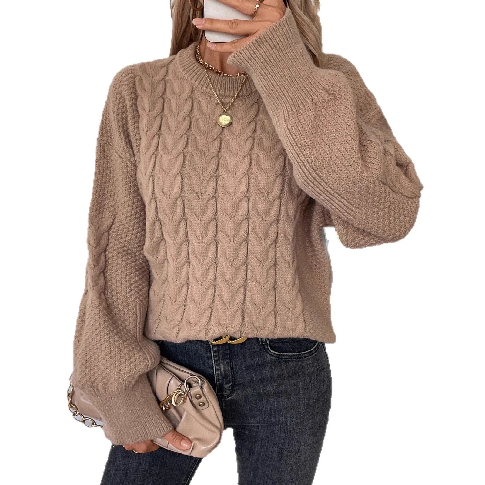 Women's beige loose round neck casual polyester sweater on a hanger.