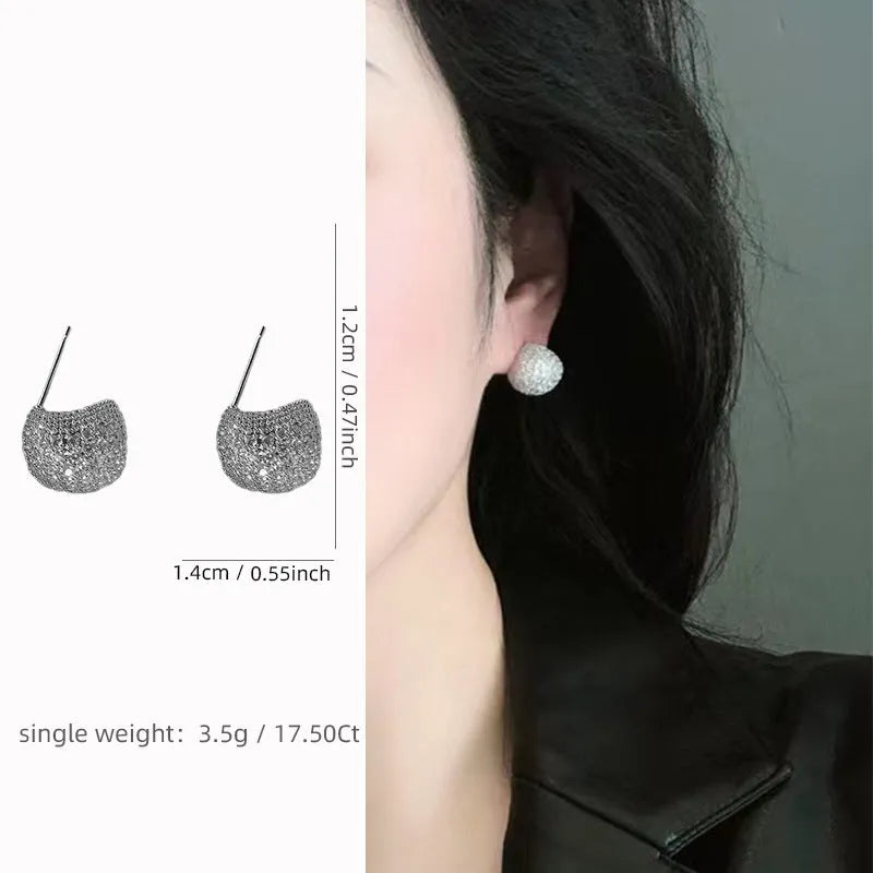 Little Golden Beans geometric drop earrings with spherical elements and diamond detailing in gold and white colours