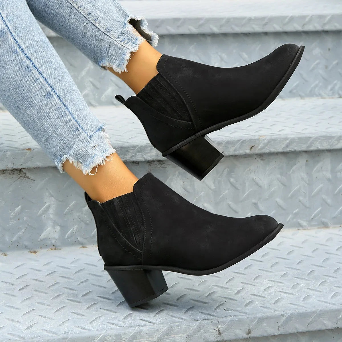 Women's black ankle boots with pointed toe and thick square heel slip-on design