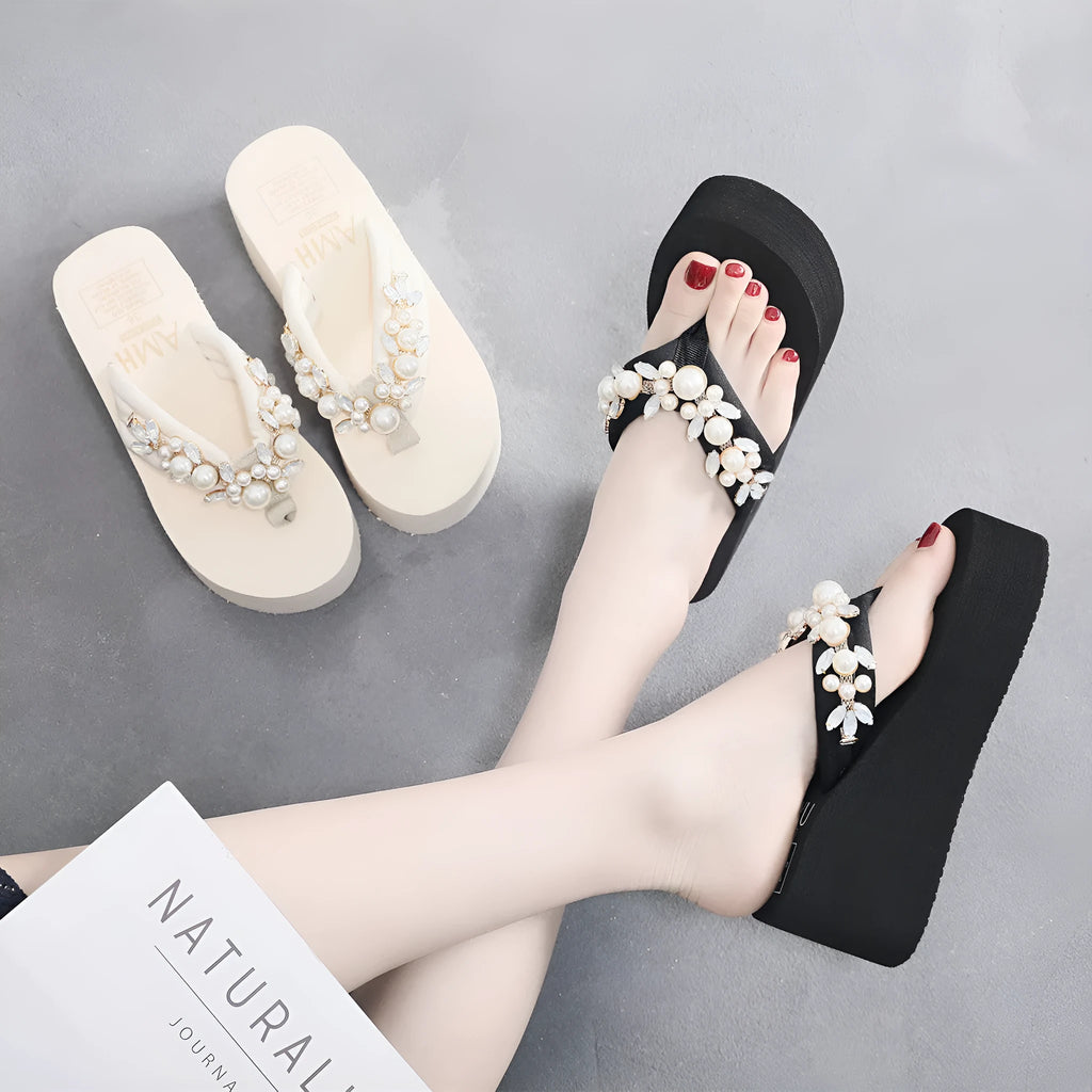 Women's beige high-heeled flip-flops with a cotton cloth upper on a white background.