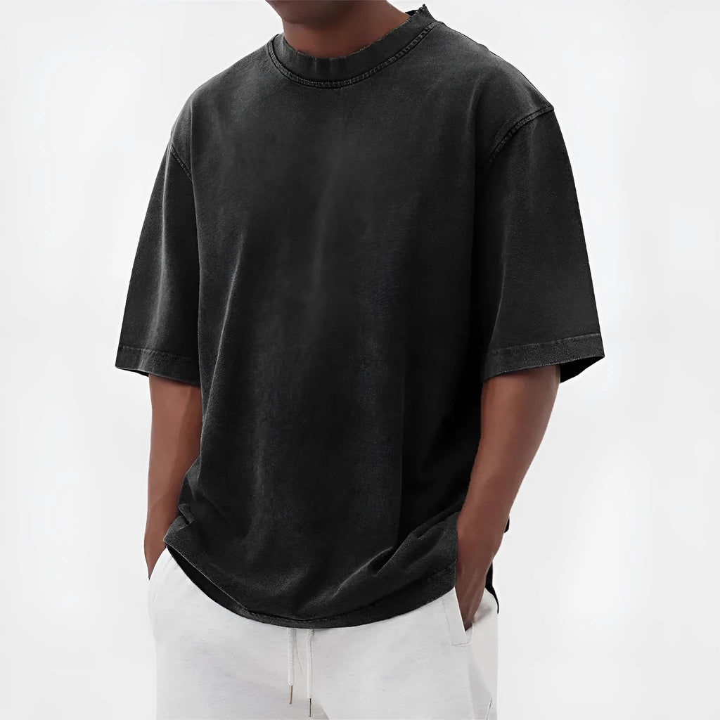 Men's loose-fit stone-washed t-shirt in army green showing distressed texture and pullover style.