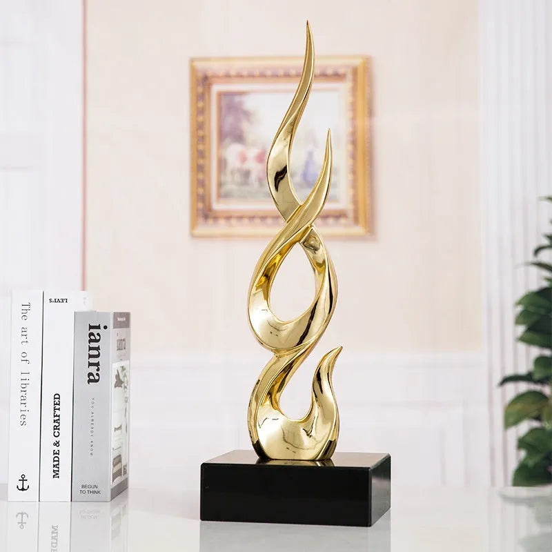 Festival high-rise decoration ornament in resin and plastic showing bright gold finish and modern simplicity style