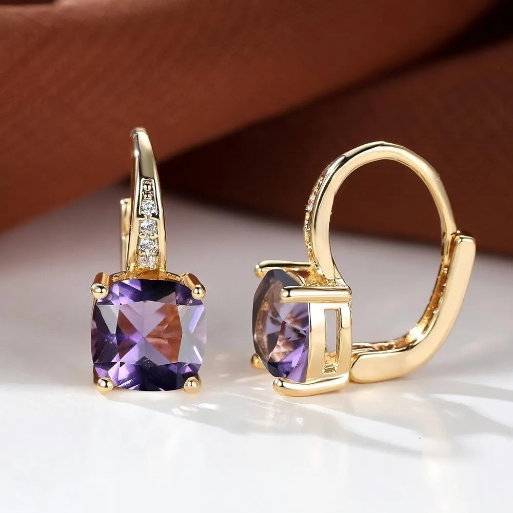 Square geometric ear hook earrings with zircon stones in an electroplated copper setting.
