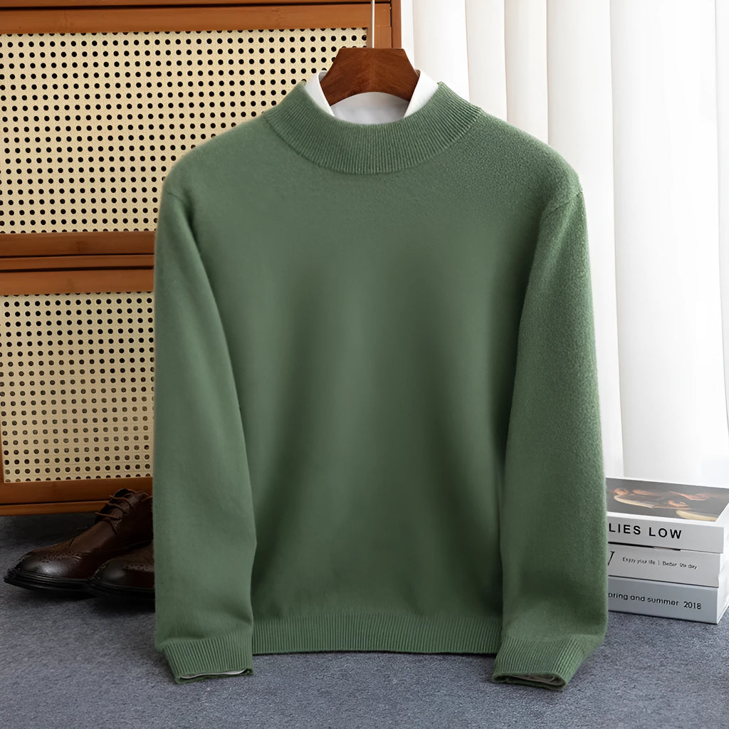 Man wearing a loose-fit half-collar wool sweater in a dark colour, showcasing the knitted texture and neckline design.