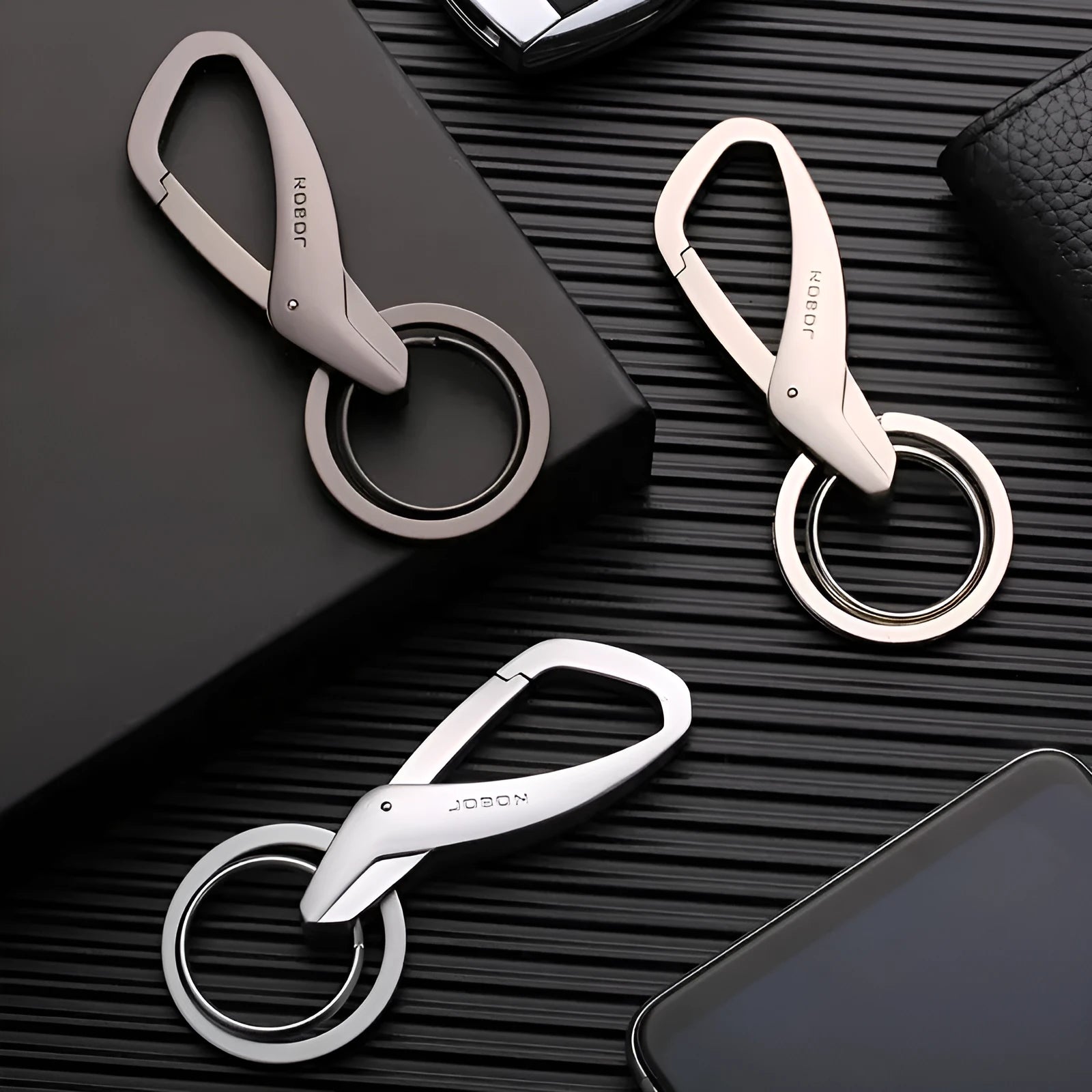 Zinc alloy car key waist hanging double ring in black chrome or nickel colour measuring 8.3 by 3.5 centimetres