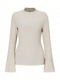 Black slim fit long sleeve top with round neck and lantern sleeves on a mannequin.