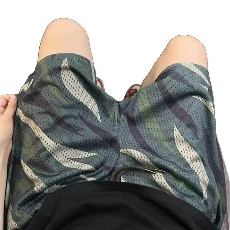 Men's camouflage pattern cotton blend mesh shorts in a straight leg style.