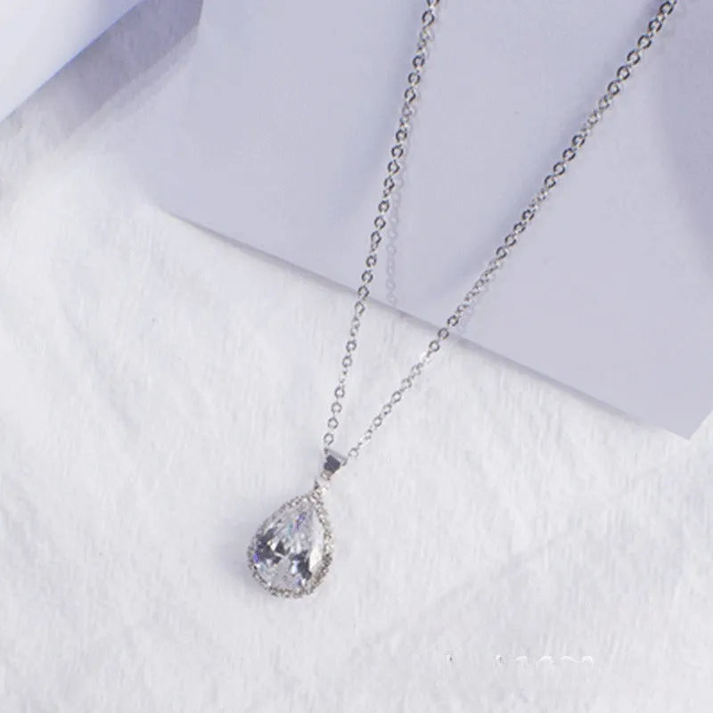 Rose gold plated drop pendant necklace with colourful rhinestones in a pink colour option.