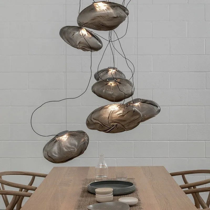 Modern glass and fabric chandelier light fixture in amber, clear or smoke grey.