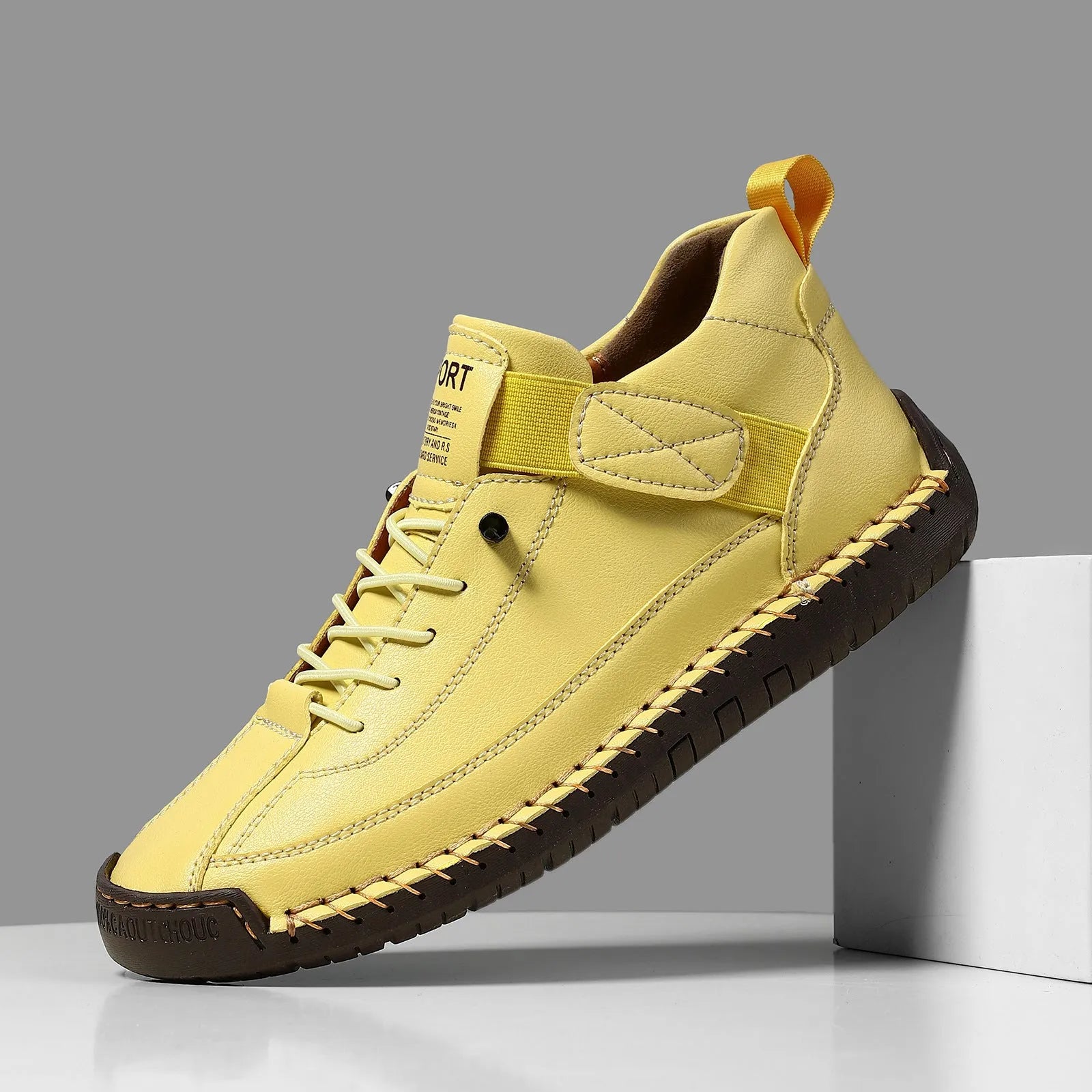 Men's mid-top Martin boot in khaki colour with tooling stitching on the rubber sole.