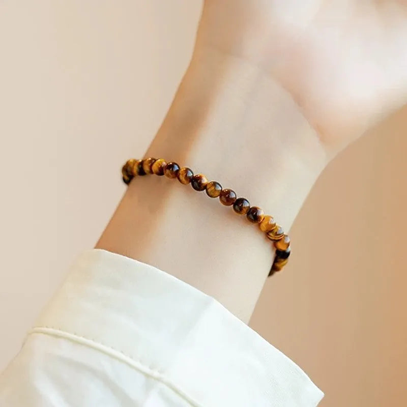 Tigereye stone bracelet with geometric design in Chinese style, showing bead details