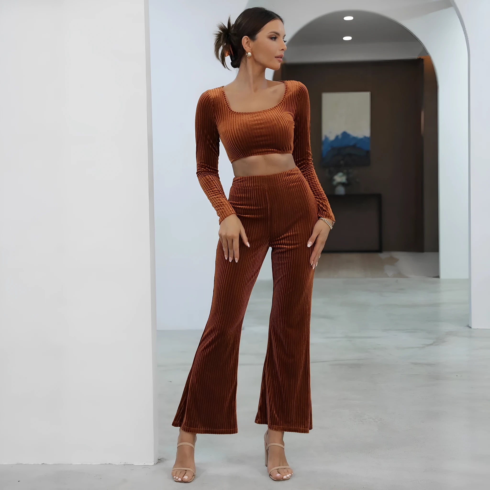 Caramel-coloured long sleeve sweater and trouser set on hanger