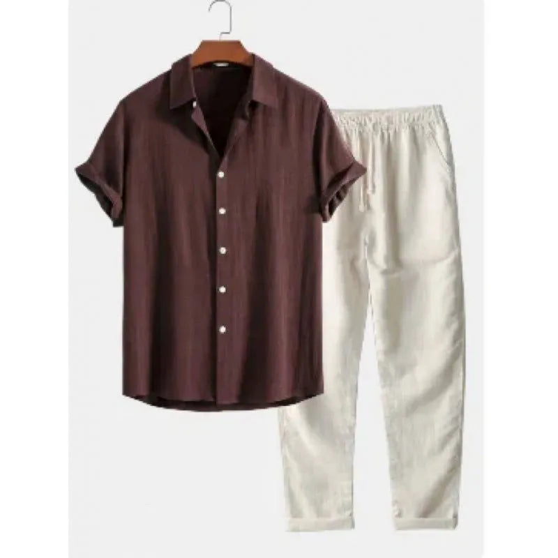 Man wearing a loose-fit light-coloured linen short-sleeve shirt and matching casual trousers from a two-piece suit set.