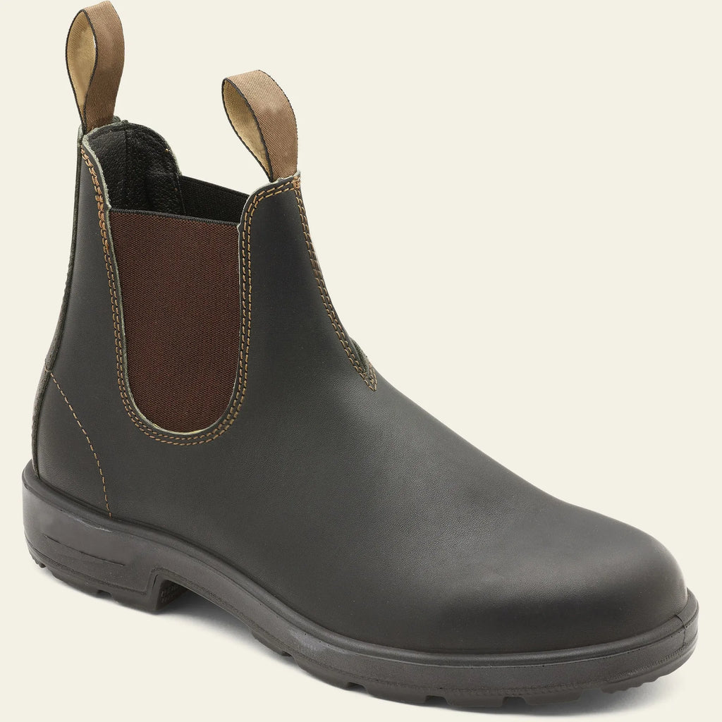 Vintage frosted brown leather Chelsea boot with round toe and low heel on a wooden surface.
