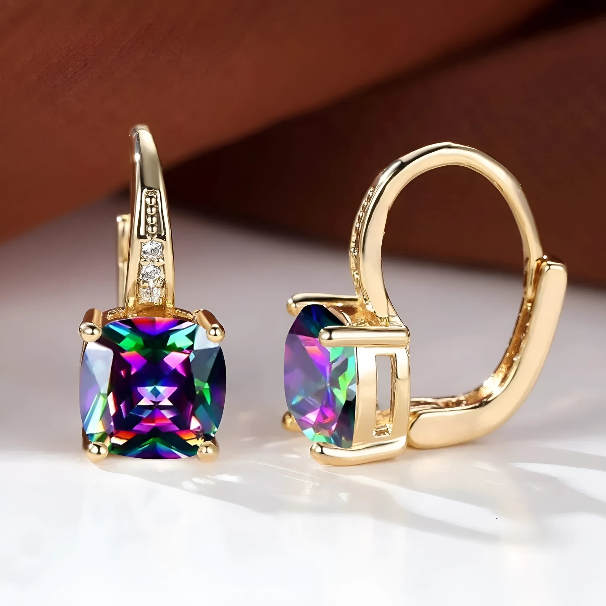 Geometric square copper ear clip earrings with moissanite inlays in a gold electroplated finish.