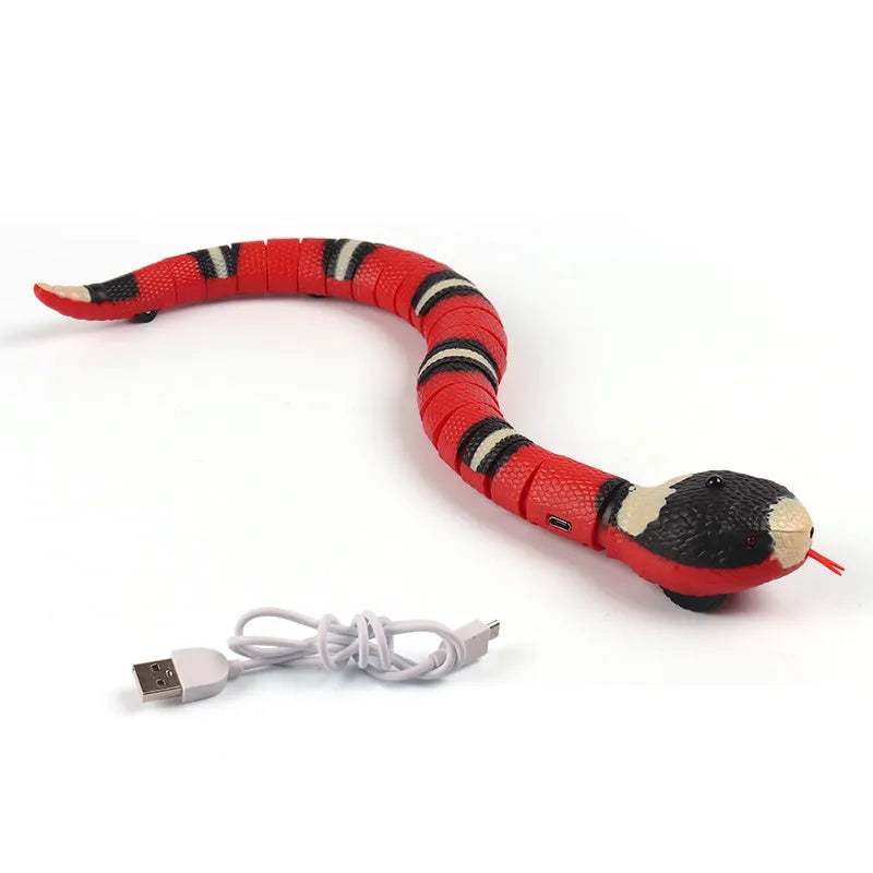 Smart sensing electronic snake cat toy with segmented plastic body and USB charging cable.