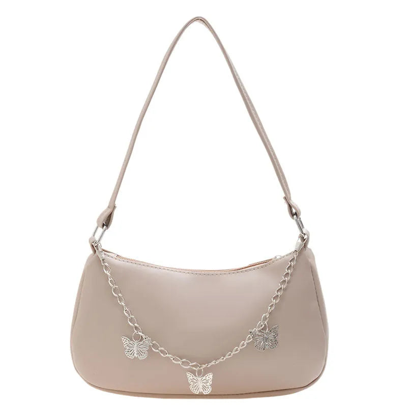 Retro-style square crossbody handbag with a butterfly clasp on its chain strap.