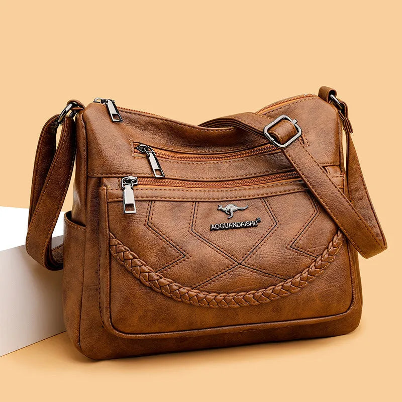 Soft PU leather crossbody shoulder bag in horizontal square shape with crossbody strap