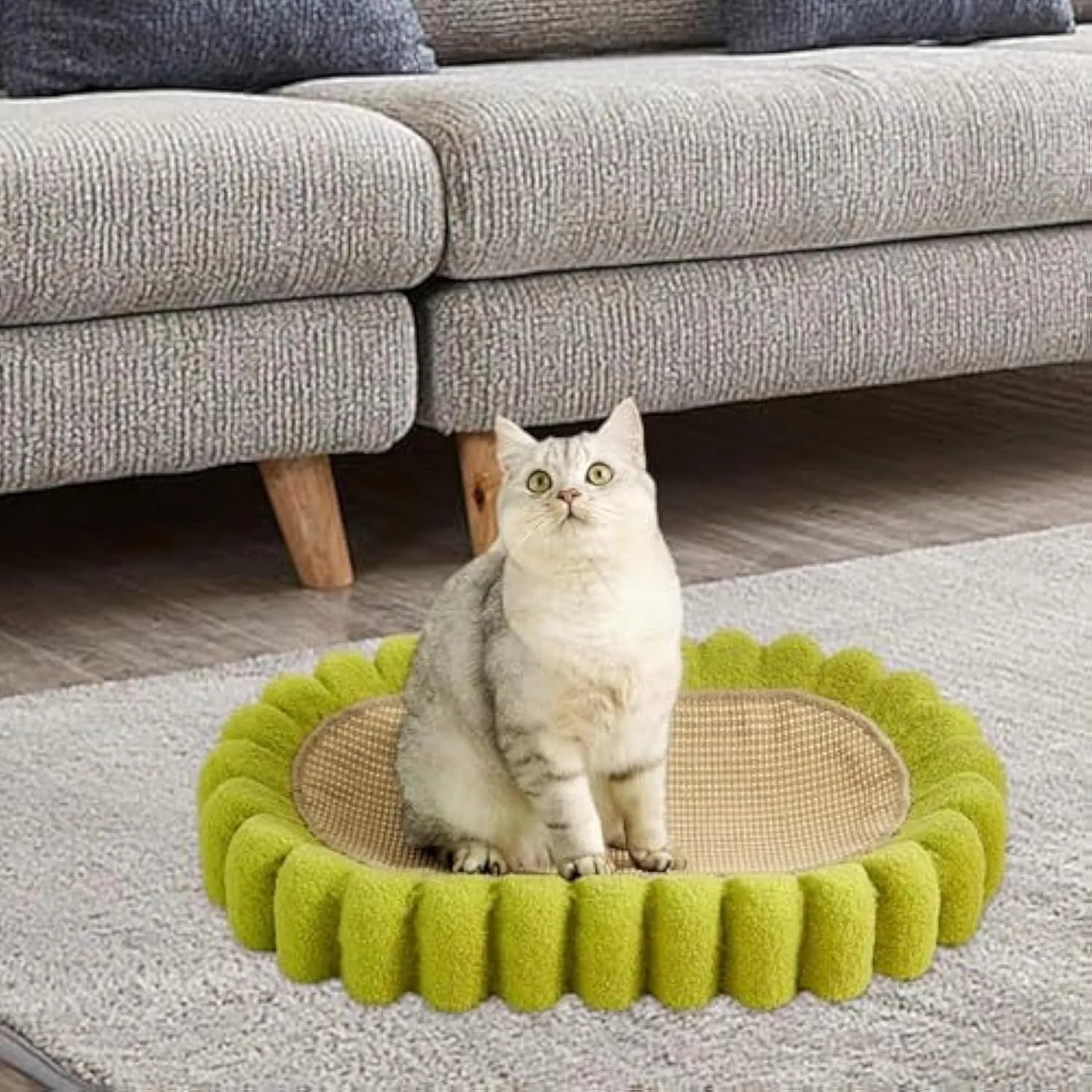 Green oval cat scratch pad and lounge bed made from sisal material