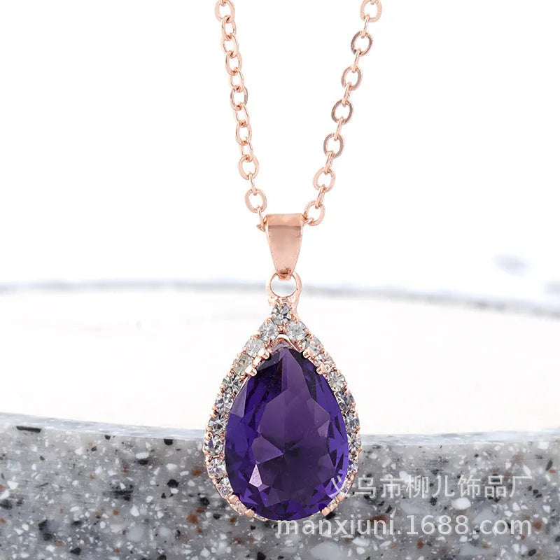 Rose gold plated drop pendant necklace with colourful rhinestones in a pink colour option.