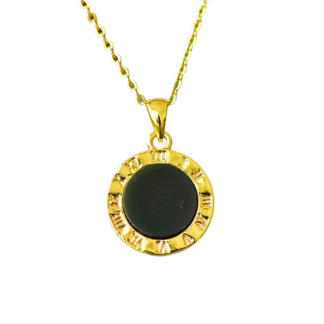 Flat gray and ink blue Hetian Jade pendant with copper inlaid decoration on a necklace.
