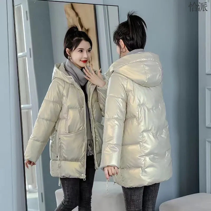 A women's loose-fit hooded winter jacket in a thick padded design, shown in one of four colour options.