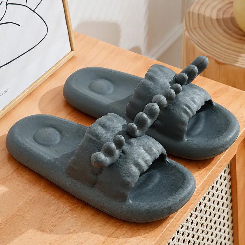 White women's flip flop slippers with deer horn design and hollow-out EVA upper on a light background.