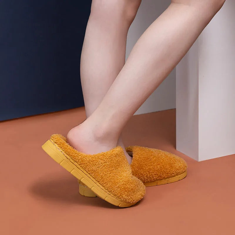 Furry suede thickened non-slip bedroom slippers in caramel colour on tiled floor