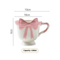 Ceramic mug with heart bow design in cute style showing Black Pink and White Powder colour options