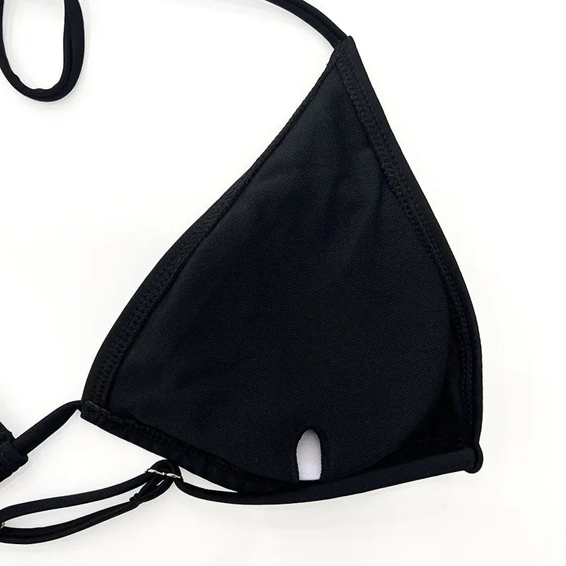 Black long sleeve mesh bikini top and briefs from a four-piece women's swimwear set.