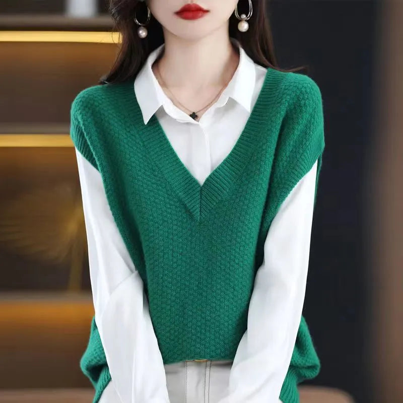 Creamy-white knitted sleeveless vest with 3D pattern and V-neck on a hanger