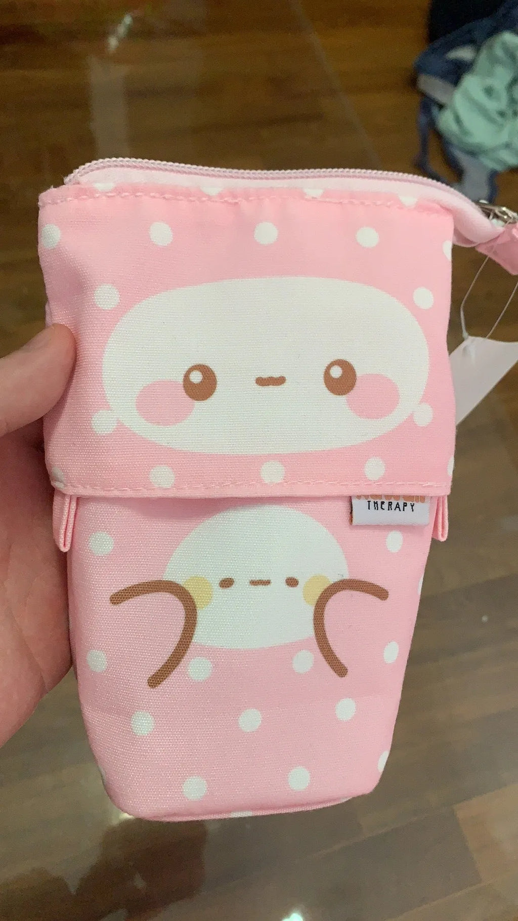 Pink pencil case with zip closure, suitable for storing pens and pencils