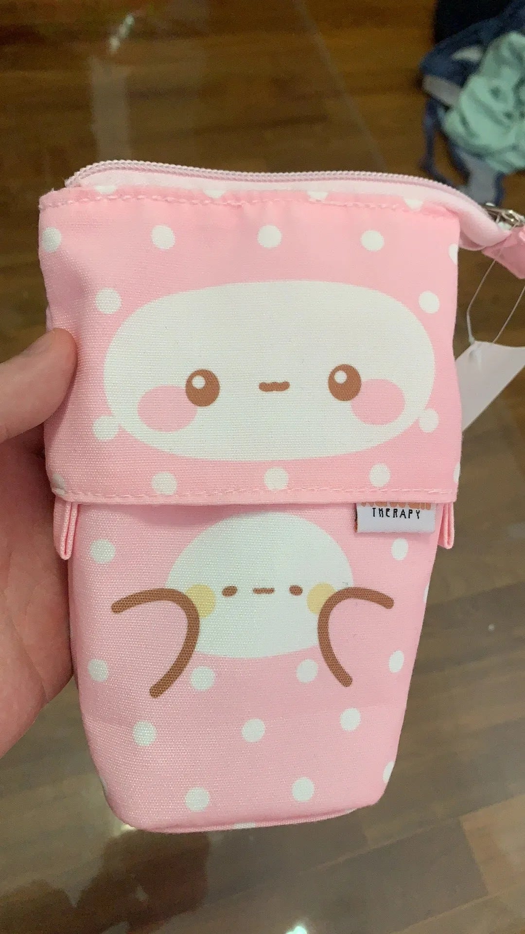 Pink pencil case with zip closure, suitable for storing pens and pencils