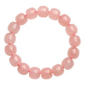 Pink barrel-shaped crystal bead bracelet with polished finish and original geometry design