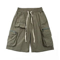 Men's mid-waist cargo shorts in solid green colour made from polyester