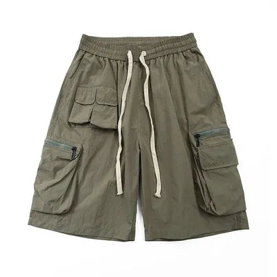Men's mid-waist cargo shorts in solid green colour made from polyester