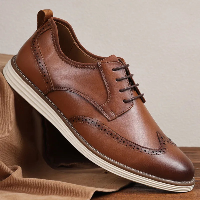 Men's black slip-on business casual shoes with decorative carved detailing and TPR soles